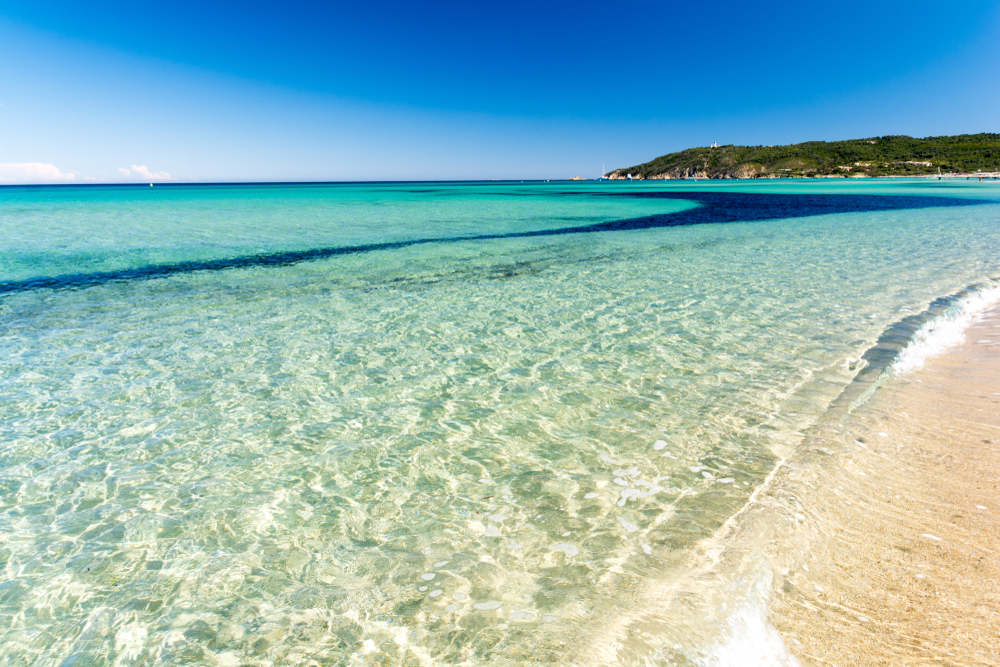 Superyacht anchored off Pampelonne Beach with Saint-Tropez coastline