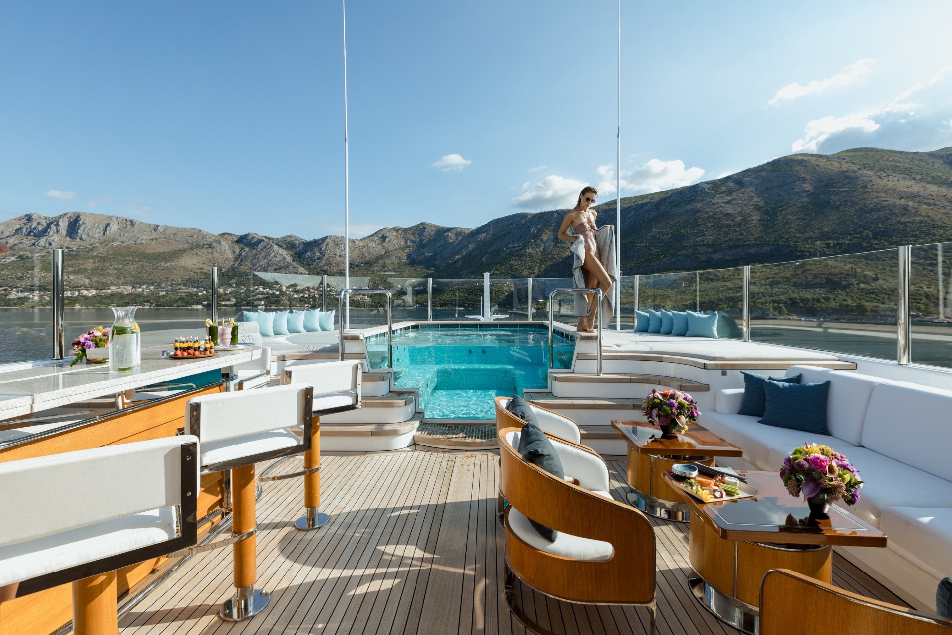 Superyacht pool deck overlooking Sardinia's emerald waters at Costa Smeralda
