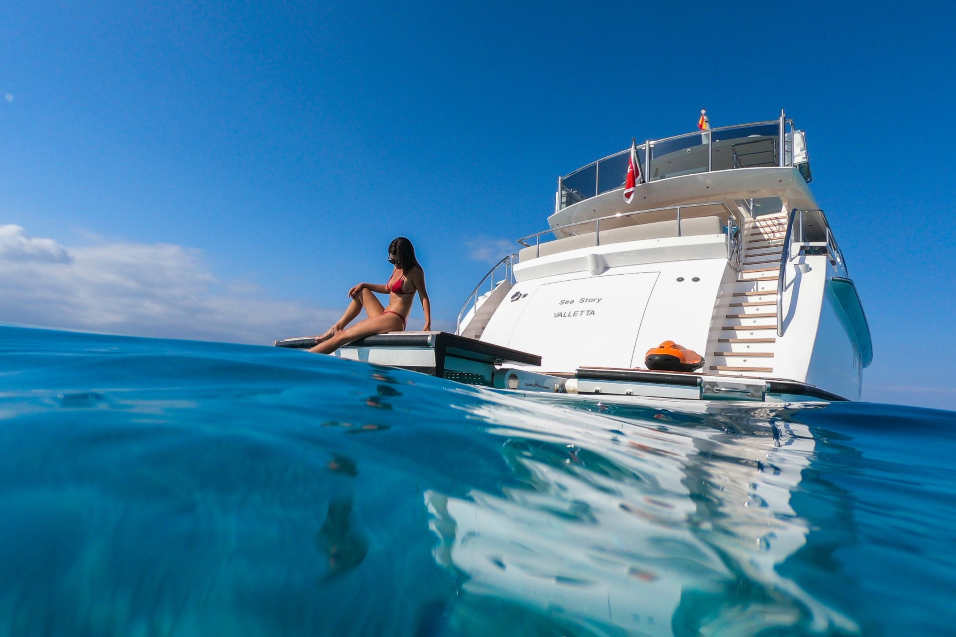 Vanquish 82 yacht cruising at waterline level between French Riviera ports
